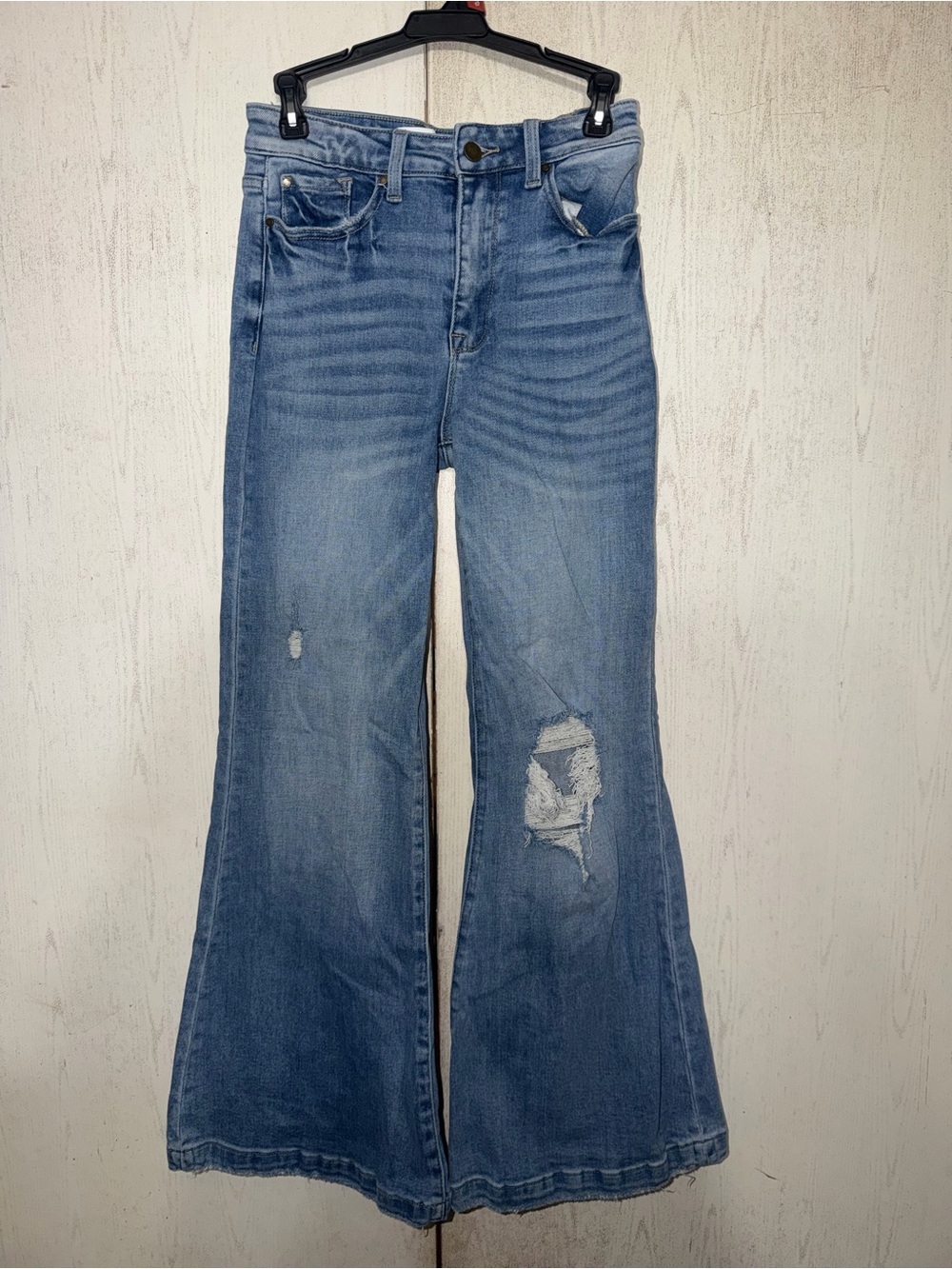 High-Rise Light Blue Flared Jeans with Distressed Knees
